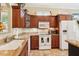 Well-equipped kitchen with lots of granite counters, and updated appliances at 2512 Baywater Rd, Tavares, FL 32778