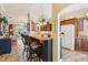 Open kitchen features bar seating, granite counters, and stainless appliances at 2512 Baywater Rd, Tavares, FL 32778