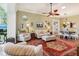 Bright living room with stylish furnishings, hardwood floors, and adjacent dining area with seating at 2512 Baywater Rd, Tavares, FL 32778