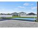 Community recreation area featuring a colorful pickleball court and seating, ideal for outdoor activities at 2512 Baywater Rd, Tavares, FL 32778