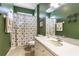 Bright bathroom with a vanity, toilet, and patterned shower curtain at 27328 Pine Straw Rd, Leesburg, FL 34748