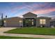 Charming single-story home with a well-maintained lawn and a two-car garage at 27328 Pine Straw Rd, Leesburg, FL 34748