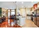 Bright kitchen with stainless steel appliances, white cabinets, and an open layout at 27328 Pine Straw Rd, Leesburg, FL 34748