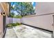Fenced backyard area with a concrete patio and mature landscaping along the border at 2815 Spyglass Cv, Longwood, FL 32779