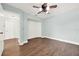 Bright bedroom with laminate floors, ceiling fan, and a built in niche for storage at 2815 Spyglass Cv, Longwood, FL 32779