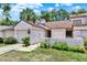 Close up view of a charming townhome exterior featuring a private garage and well maintained landscaping at 2815 Spyglass Cv, Longwood, FL 32779
