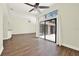Open living room with hardwood floors, large glass doors, and ample natural light at 2815 Spyglass Cv, Longwood, FL 32779