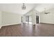 Spacious living room with lots of natural light, wood-look flooring, and sliding glass doors at 2815 Spyglass Cv, Longwood, FL 32779