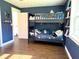 bedroom featuring a bunk bed, hardwood floors, and playful decor, creating an inviting space at 32511 Purdum Ave, Leesburg, FL 34788