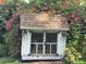 Charming chicken coop surrounded by bougainvillea at 32511 Purdum Ave, Leesburg, FL 34788