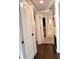 Hallway showcasing the bathroom and laundry areas with new flooring at 32511 Purdum Ave, Leesburg, FL 34788