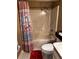 Cozy bathroom featuring a shower-tub combo with a seashell-themed shower curtain and basic fixtures at 327 Bentwood Dr, Leesburg, FL 34748