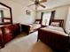 Comfortable bedroom with twin beds, dresser, and a large window with natural light at 327 Bentwood Dr, Leesburg, FL 34748