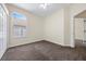 Cozy bedroom with neutral walls, plush carpet and a large window for natural light at 33441 Irongate Dr, Leesburg, FL 34788