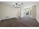 Inviting living room with neutral carpet and a large bay window providing plenty of natural light at 33441 Irongate Dr, Leesburg, FL 34788