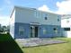 The back of the home features a sliding glass door out to a deck in the spacious backyard at 418 Winter Bliss Ln, Mount Dora, FL 32757