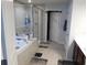 Well lit bathroom featuring a jacuzzi tub, glass enclosed shower and neutral color scheme at 418 Winter Bliss Ln, Mount Dora, FL 32757
