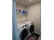Efficient laundry room equipped with modern washer and dryer and convenient storage shelf at 418 Winter Bliss Ln, Mount Dora, FL 32757