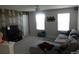 Relaxing living room showcases a decorative accent wall and comfortable sectional for cozy Gathering time at 418 Winter Bliss Ln, Mount Dora, FL 32757