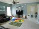 Inviting living room features neutral paint, ceiling fan, and abundant space for entertainment or relaxation at 418 Winter Bliss Ln, Mount Dora, FL 32757