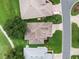 Drone shot of home with mature landscaping, and golf course view at 4909 Kelso St, Leesburg, FL 34748