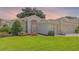 Charming single Gathering home with an arched entry and well manicured landscaping at 4909 Kelso St, Leesburg, FL 34748
