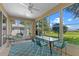 Enclosed sunroom with lots of windows and views of the yard at 4909 Kelso St, Leesburg, FL 34748