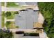 An aerial view of a home featuring a well-maintained roof and lush greenery at 501 Washington Ave, Eustis, FL 32726