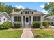 Charming bungalow with a screened front porch and manicured landscaping at 501 Washington Ave, Eustis, FL 32726