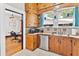 This is a lovely kitchen with wooden cabinets, stainless steel appliances, and an open view to the dining room at 501 Washington Ave, Eustis, FL 32726