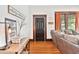 Inviting living room featuring hardwood floors, cozy furniture, and classic trim at 501 Washington Ave, Eustis, FL 32726
