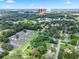 Aerial shot showcases land parcel near commercial spots and residential areas at 504 Gilliam St, Wildwood, FL 34785