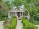 Charming home with well maintained lawn, lovely landscaping, and inviting front entrance at 504 Gilliam St, Wildwood, FL 34785