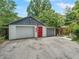 Exterior of three car garage with American flag at 504 Gilliam St, Wildwood, FL 34785