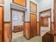 Hallway view of a kitchen and bedroom, showcasing the home's layout and wooden accents at 504 Gilliam St, Wildwood, FL 34785