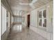 Enclosed porch with wood paneled walls and ceiling, tile floors and lots of natural light at 504 Gilliam St, Wildwood, FL 34785