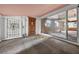 Bright sunroom featuring multiple windows and access to the exterior, offering lots of natural light at 54544 Buckhorn Rd, Astor, FL 32102