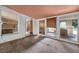 Bright sunroom featuring multiple windows and access to the exterior, offering lots of natural light at 54544 Buckhorn Rd, Astor, FL 32102