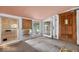 Bright sunroom featuring multiple windows and access to the exterior, offering lots of natural light at 54544 Buckhorn Rd, Astor, FL 32102