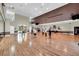 Spacious activity room with hardwood floors, ideal for group activities and fitness at 5715 Illumination Ln, Leesburg, FL 34748