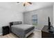 Bedroom with wood floors and window with view of the backyard at 5715 Illumination Ln, Leesburg, FL 34748