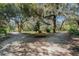 Scenic park with lush greenery, walking paths, and a gazebo, perfect for relaxation at 5715 Illumination Ln, Leesburg, FL 34748