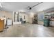 Garage equipped with washer, dryer, and utility sink for added convenience at 5715 Illumination Ln, Leesburg, FL 34748