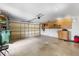 Spacious two-car garage with ample storage and work area at 5715 Illumination Ln, Leesburg, FL 34748