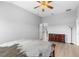 Main bedroom featuring neutral paint, ceiling fan, and wood flooring at 5715 Illumination Ln, Leesburg, FL 34748