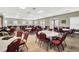 Versatile meeting room featuring tables and chairs, perfect for gatherings and events at 5715 Illumination Ln, Leesburg, FL 34748