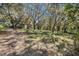 A beautiful park with a walking path and a gazebo shaded by moss-covered trees offers a tranquil outdoor experience at 5715 Illumination Ln, Leesburg, FL 34748