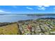 Panoramic aerial view of a residential community near a waterfront at 5740 Bounty Cir, Tavares, FL 32778