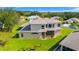 Lush backyard featuring well-maintained green grass and privacy at 5740 Bounty Cir, Tavares, FL 32778