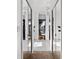 Bathroom showcasing double glass door shower, white tile, decorative accents, and fan at 5740 Bounty Cir, Tavares, FL 32778